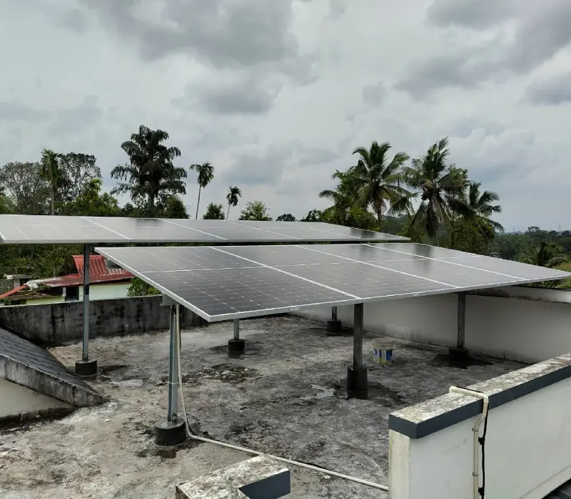 Solar panel array installed on a flat concrete roof in Goa
