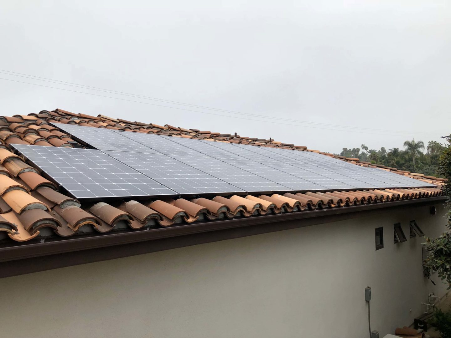 Solar panels installed on a clay tile roof in Goa